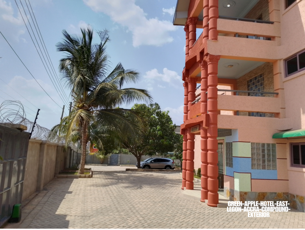 Green Apple Hotel East Legon Hills Accra compound exterior — safe gated environment for first-time visitors and families